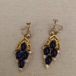 A&Z: Gold tone and faux blue rhinestones screw back dangle earrings.